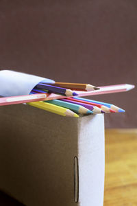 Close-up of multi colored pencils on table