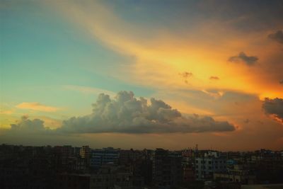 Cityscape against sky during sunset