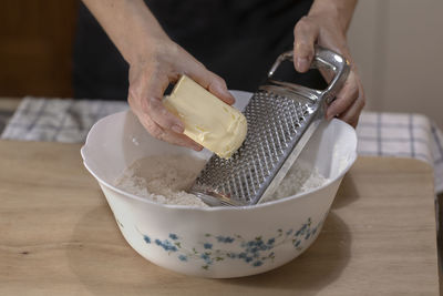 Midsection of man preparing food on table