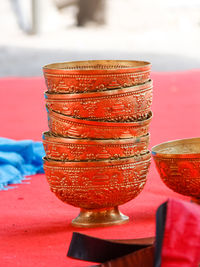 Close-up of red wine on table in temple