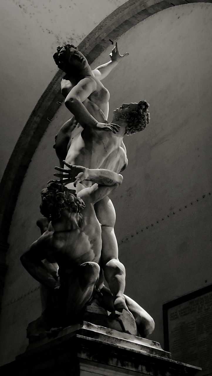 LOW ANGLE VIEW OF STATUE IN CITY