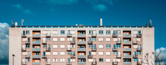 Low angle view of building against blue sky