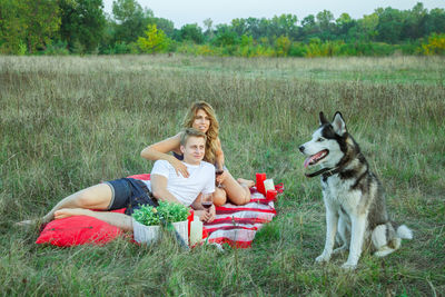 Friends sitting on field