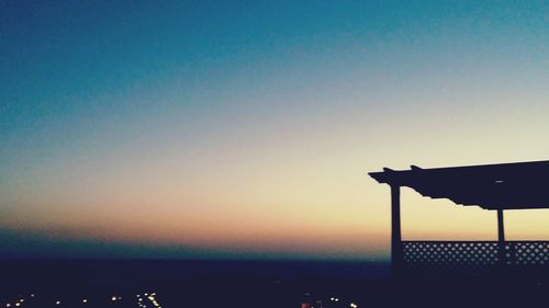 Scenic view of sea against clear sky during sunset