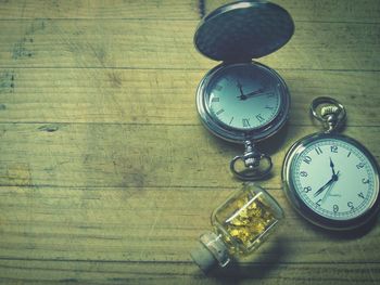 High angle view of clock on table