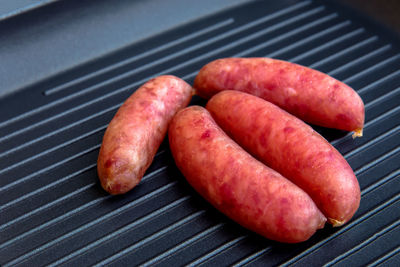 High angle view of meat on barbecue grill