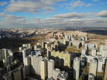 High angle view of modern buildings in city against sky