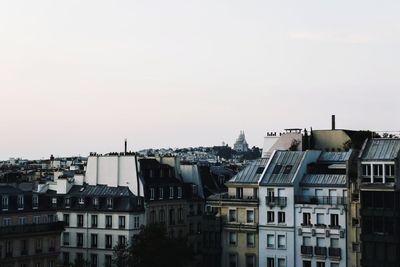 Buildings in city against sky