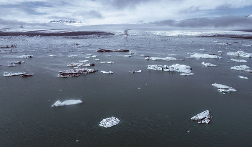 Scenic view of sea against sky during winter