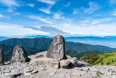 Rock formations on mountain against sky