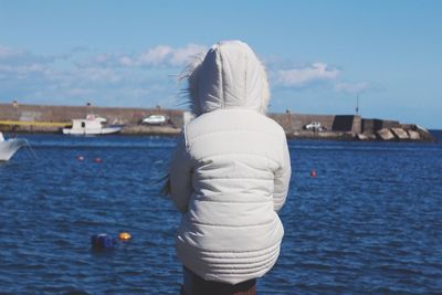 Portrait of young woman in water