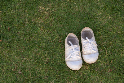 High angle view of shoes on grass