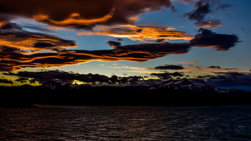 Scenic view of lake at sunset