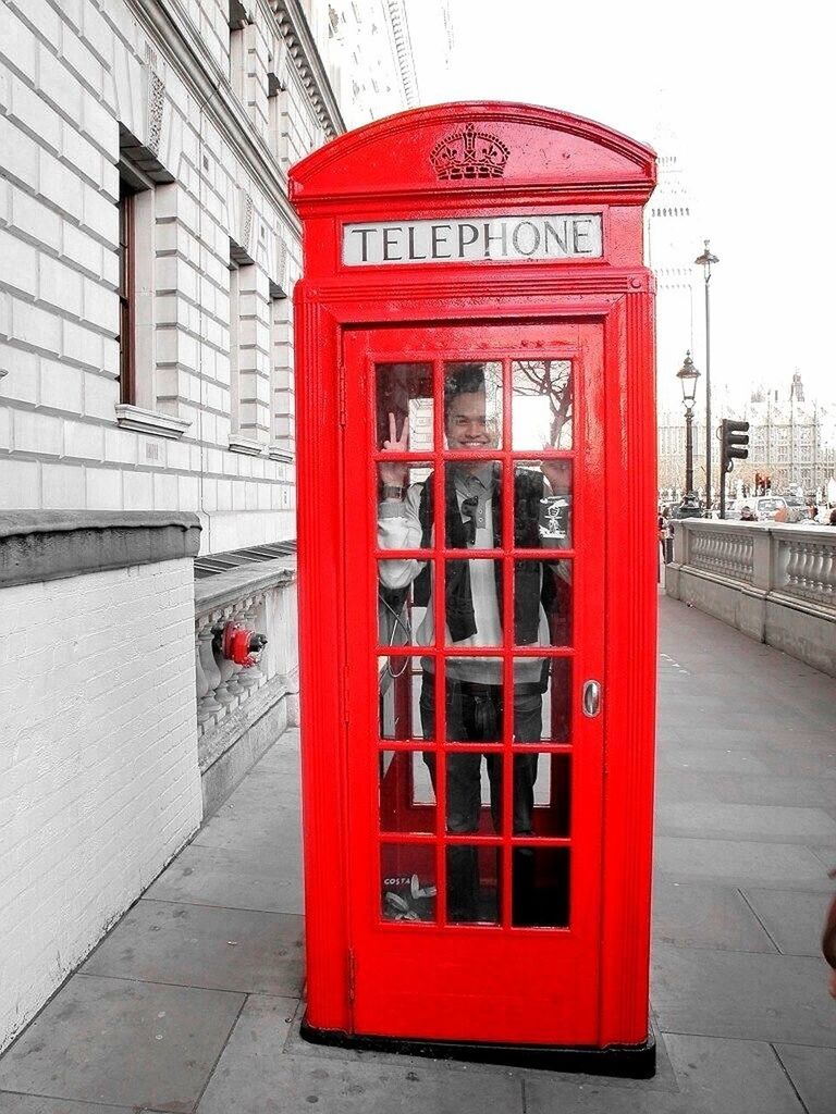 red, architecture, building exterior, built structure, door, communication, text, closed, western script, entrance, city, safety, telephone booth, day, window, no people, outdoors, protection, non-western script, security