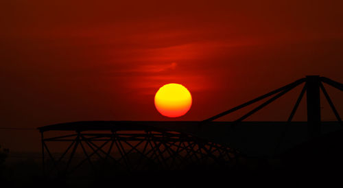 Sun shining through orange sky