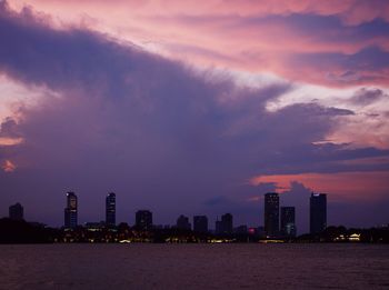 Scenic view of buildings against sky at dusk