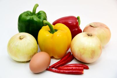 Close-up of bell peppers against white background