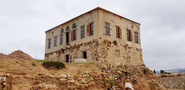 Low angle view of old building against sky