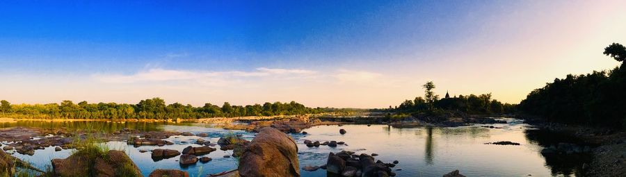 Panoramic view of lake against sky during sunset