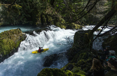 A kayaker descends the little white salmon river in the wa.