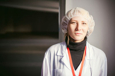 Female doctor standing in hospital lobby