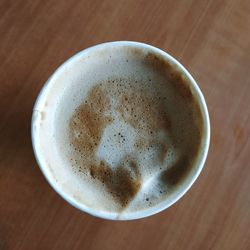 High angle view of coffee cup on table