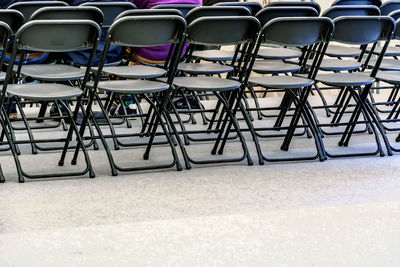 Empty chairs arranged on floor