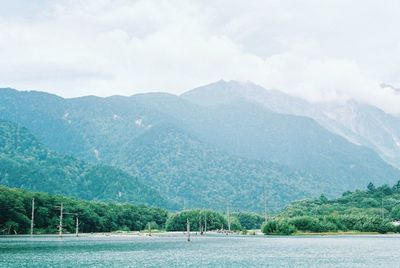 Scenic view of lake with mountains in background