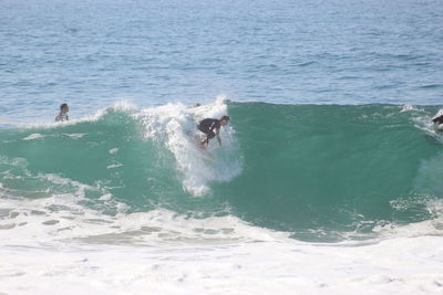 Man surfing in sea