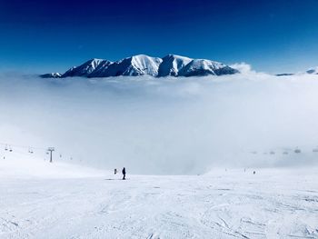 Scenic view of snowcapped mountains against sky