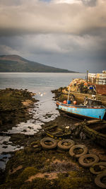 Boats moored on sea against sky