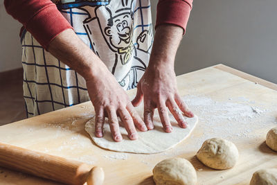 Midsection of man preparing food