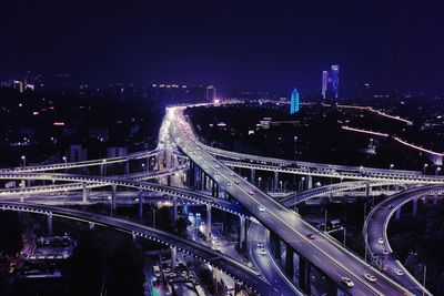 High angle view of illuminated bridge at night