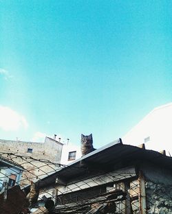 Low angle view of built structure against clear blue sky