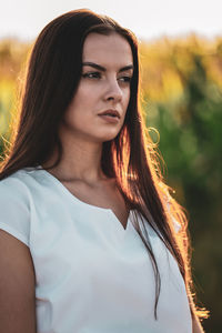 Portrait of young woman looking away