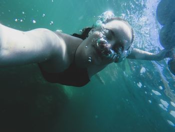 High angle view of woman swimming 