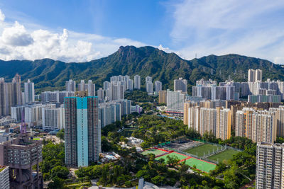 High angle view of buildings in city against sky