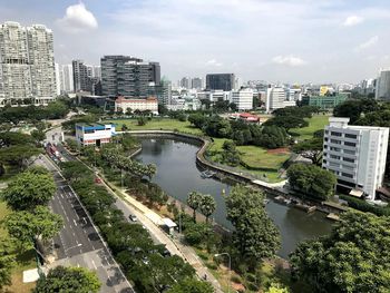 High angle view of canal amidst buildings in city