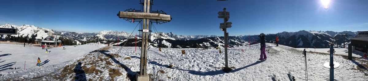 Panoramic view of snow covered mountains against sky