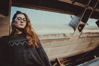 Low angle view of woman looking at camera