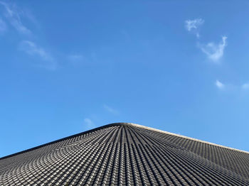 Low angle view of building against blue sky