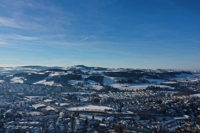 Aerial view of townscape against sky