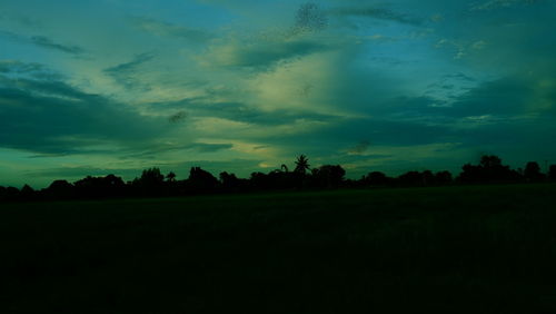 Scenic view of field against sky during sunset