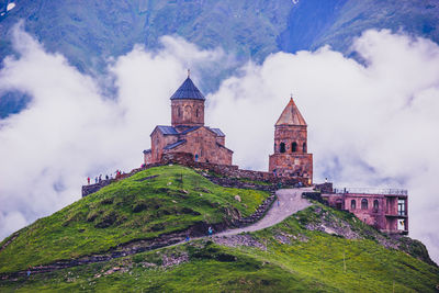 Historic building against cloudy sky