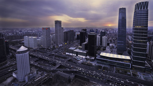 Aerial view of city at sunset