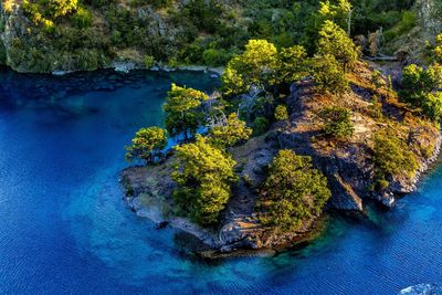 High angle view of rocks by sea