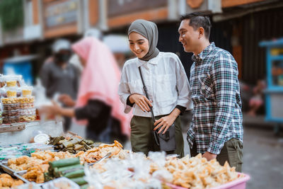 Side view of man preparing food