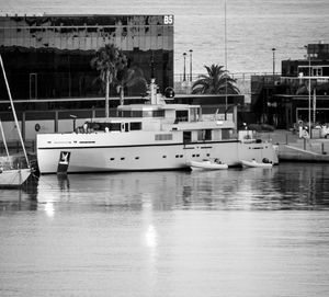 Boats moored at harbor