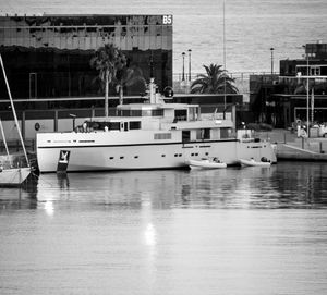 Boats moored at harbor