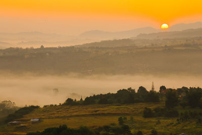 Scenic view of landscape against sky during sunset